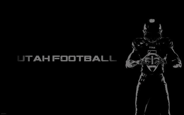 Black white football player holding free wallpaper for desktop - medium preview image