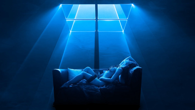 Woman couch blue light room free wallpaper for desktop - medium preview image