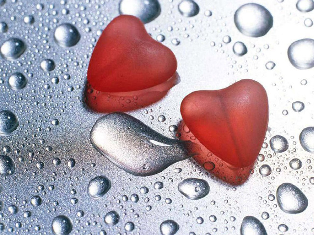 Two red hearts wet surface free wallpaper for desktop - medium preview image