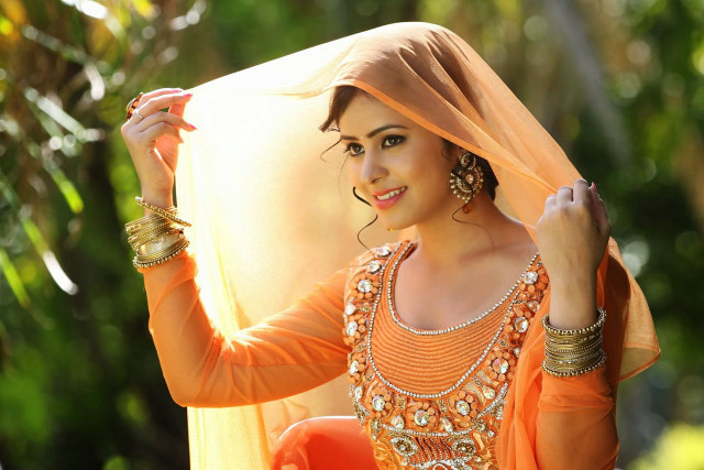 Woman orange dress holding cloth free wallpaper for desktop - medium preview image