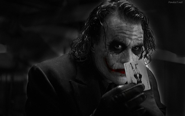 Joker man serious card holding free wallpaper for desktop - medium preview image