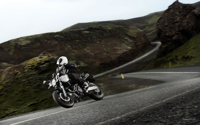 Motorcycle winding road mountainside ride free wallpaper for desktop - medium preview image