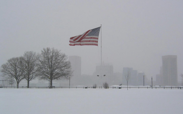 Flag waving snowy park cityscape free wallpaper for desktop - medium preview image
