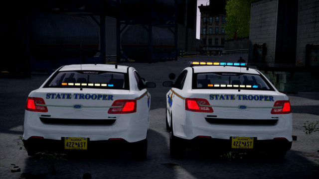 Two white police cars nighttime free wallpaper for desktop - medium preview image