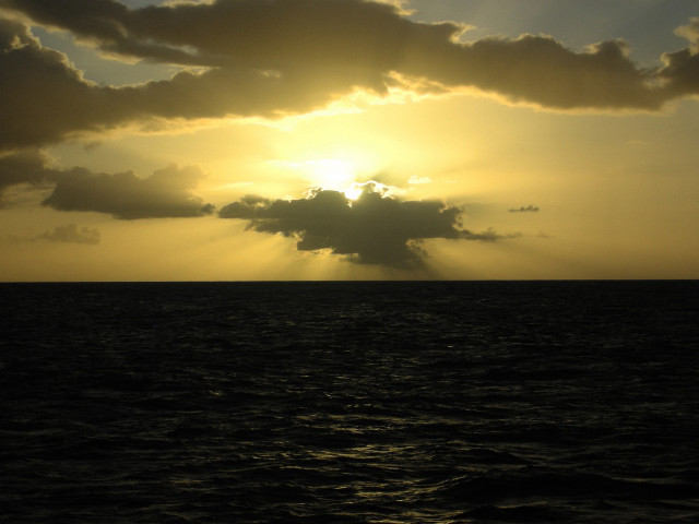 Sunshine clouds ocean boat water free wallpaper for desktop - medium preview image
