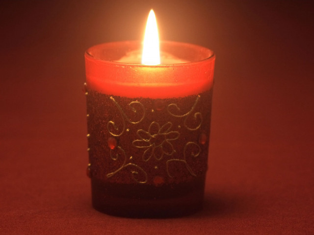 Lit candle red background white #2 free wallpaper for desktop - medium preview image