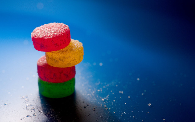 Colorful candies stack table blue #2 free wallpaper for desktop - medium preview image