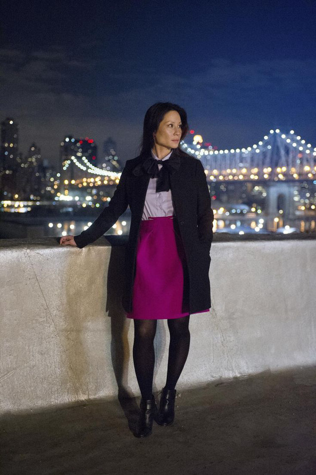 Woman standing ledged city skyline free wallpaper for mobile - medium preview image