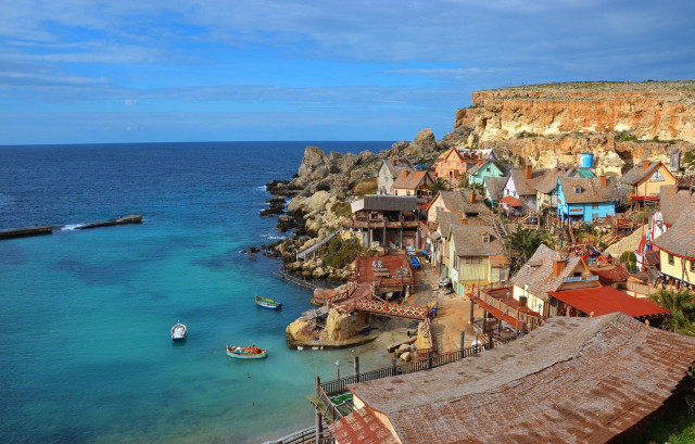 Village shore water boat cliff free wallpaper for desktop - medium preview image