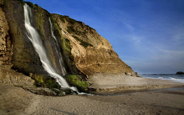 Waterfall cliff ocean sunny day free wallpaper for desktop - medium preview image