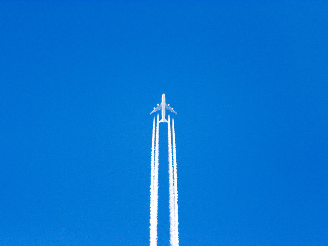 Jet flying blue sky trailing free wallpaper for desktop - medium preview image