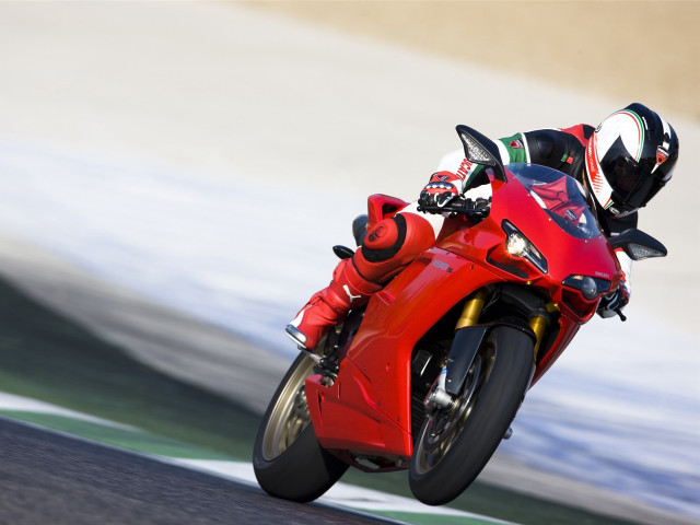 Person riding red motorcycle track free wallpaper for desktop - medium preview image