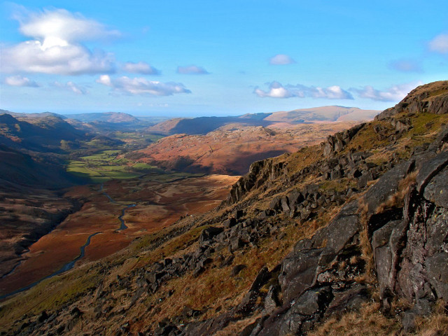 Man sitting rock mountain valley #2 free wallpaper for desktop - medium preview image