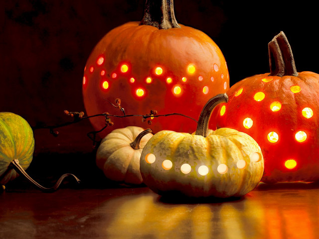 Pumpkins with lights on table free wallpaper for desktop - medium preview image