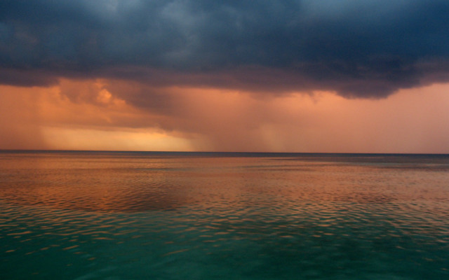 Storm cloud ocean boat sunset free wallpaper for desktop - medium preview image