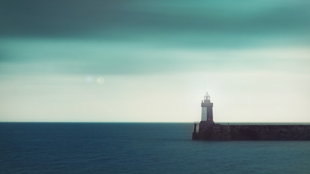 Lighthouse pier ocean cloudy sky free wallpaper for desktop - medium preview image