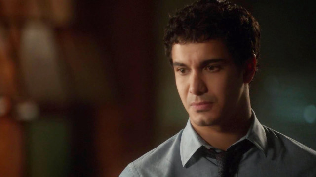 Man tie looking camera room free wallpaper for desktop - medium preview image