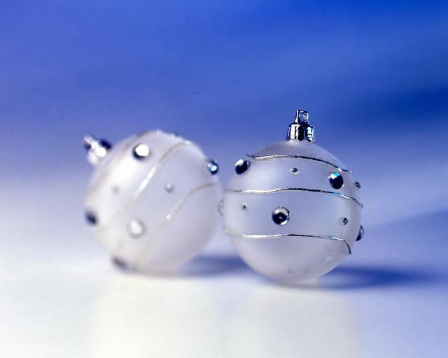 Two white ornaments sitting on #3 free wallpaper for desktop - medium preview image