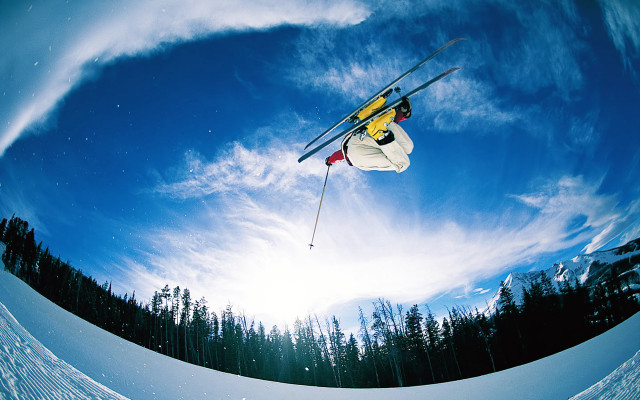 Skier midair jump snow trees #2 free wallpaper for desktop - medium preview image