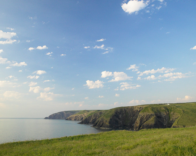 Grassy field water cliff sky #2 free wallpaper for desktop - medium preview image