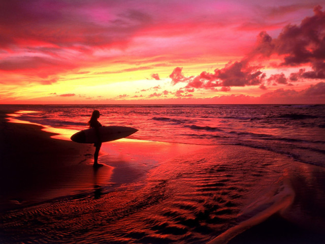 Person holding surfboard beach sunset #2 free wallpaper for desktop - medium preview image