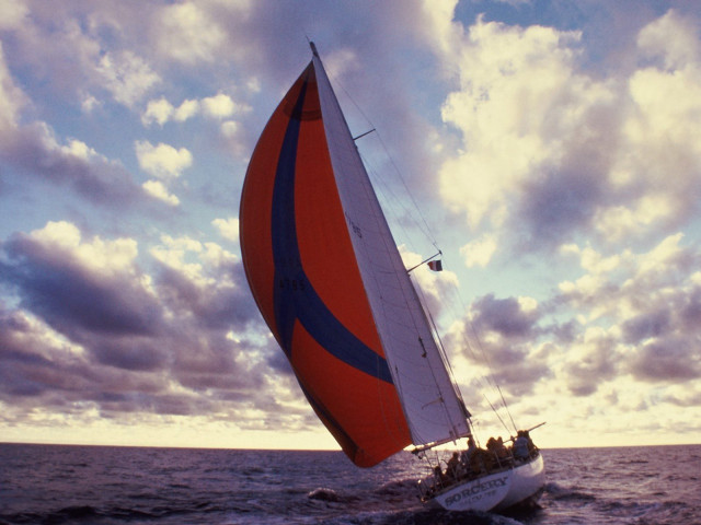 Sailboat red blue sail cloudy #2 free wallpaper for desktop - medium preview image