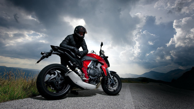 Man helmet motorcycle road stormy free wallpaper for desktop - medium preview image