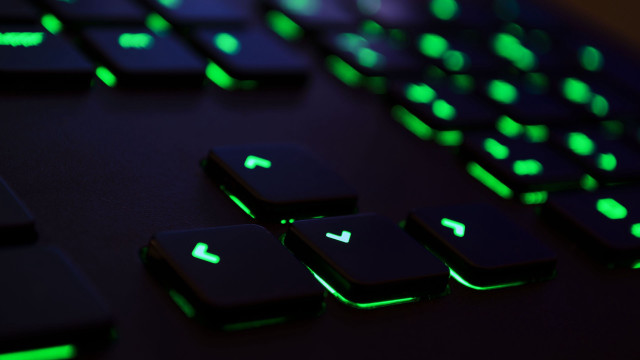Keyboard glowing keys closeup green free wallpaper for desktop - medium preview image