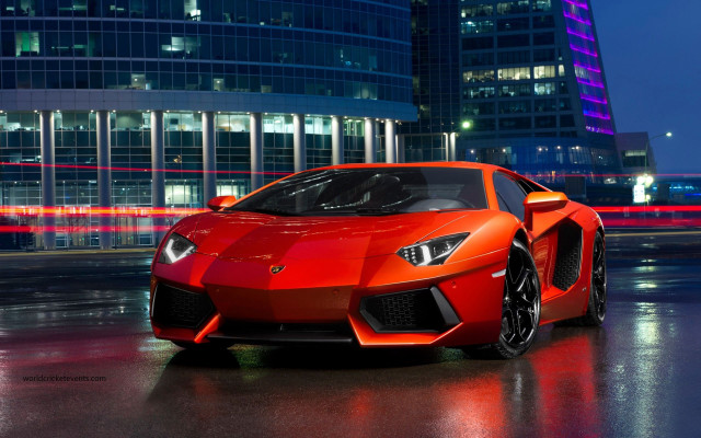 Red sports car tall building #2 free wallpaper for desktop - medium preview image