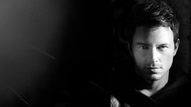 Serious man black background image free wallpaper for desktop - medium preview image