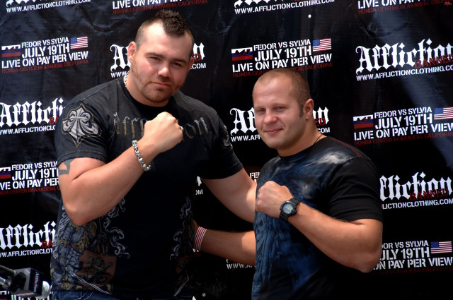 Two men black backdrop live free wallpaper for desktop - medium preview image