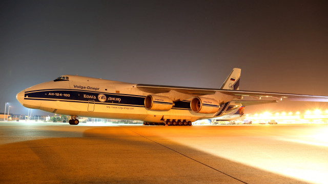 Large jetliner airport tarmac night free wallpaper for desktop - medium preview image