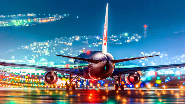 Jetliner night runway city lights free wallpaper for desktop - medium preview image