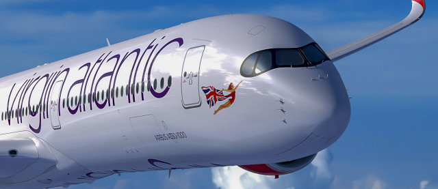 Large commercial airplane flying sky free wallpaper for desktop - medium preview image