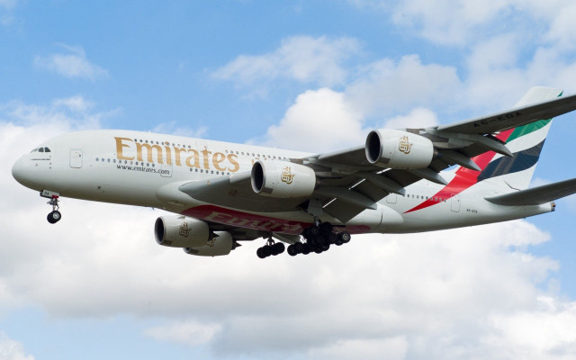 Jetliner emirates cloudy sky landing free wallpaper for desktop - medium preview image