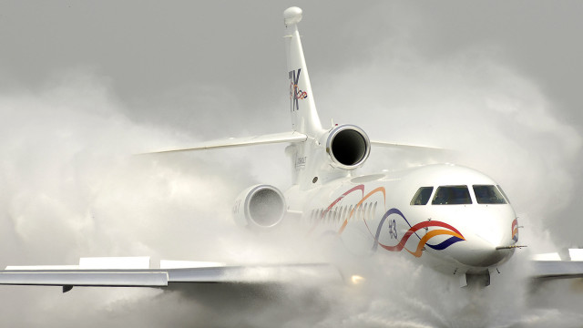 Jetliner cloudy sky runway smoke #2 free wallpaper for desktop - medium preview image