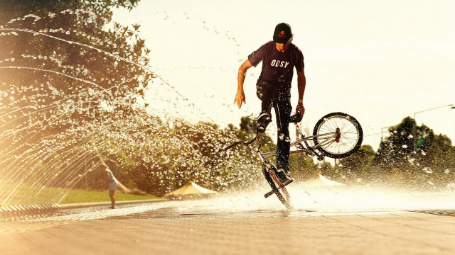 Man bike water trick sunset free wallpaper for desktop - medium preview image