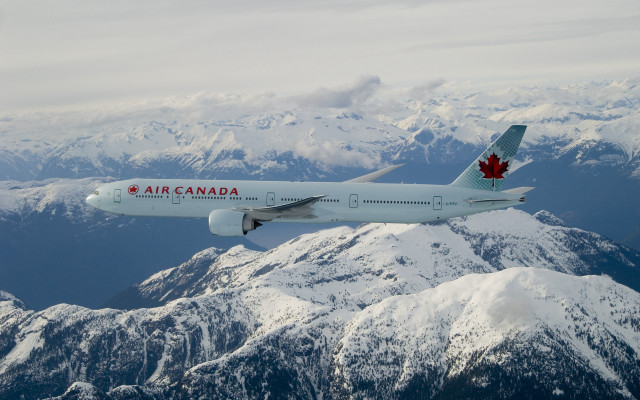 Canadian airplane flying mountain range free wallpaper for desktop - medium preview image