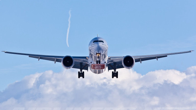 Jetliner flying blue sky cloudy free wallpaper for desktop - medium preview image