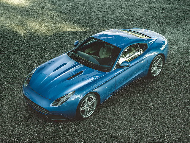 Blue sports car grass field free wallpaper for desktop - medium preview image