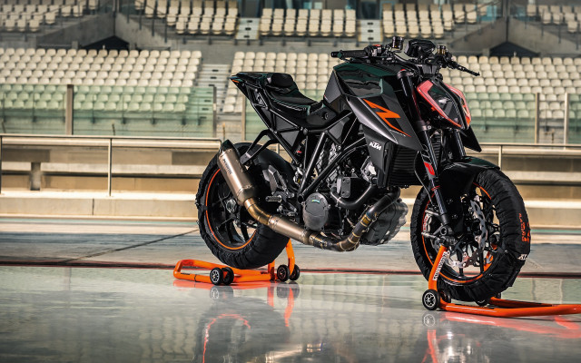 Motorcycle parked ramp stadium seats free wallpaper for desktop - medium preview image