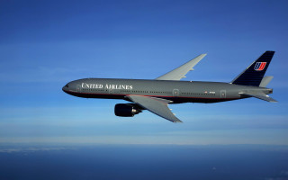 Jetliner flying blue sky ocean - a sunny day free wallpaper for desktop