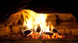 Fireplace burning rocks logs wire - a fireplace free wallpaper for desktop