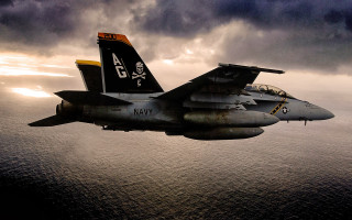 Fighter jet cloudy sky ocean 2 - a dark cloud free wallpaper