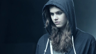 Woman hooded sweatshirt serious look - her face and shoulders free wallpaper