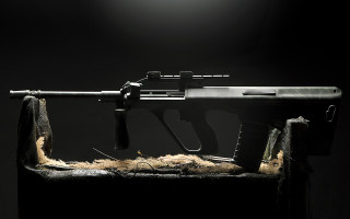 Gun fur covering table dark - the dark room free wallpaper