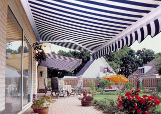 Patio awning table chairs flowers - open ceiling free wallpaper