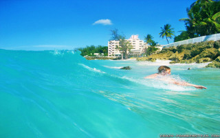 Man riding wave surfboard ocean 2 - a man riding free wallpaper