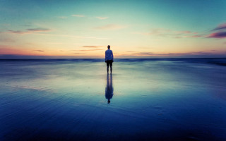 Beach sunset reflection person standing 3 - liminal space free wallpaper