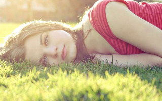 Woman smiling laying ongrass redshirt - her eye free wallpaper